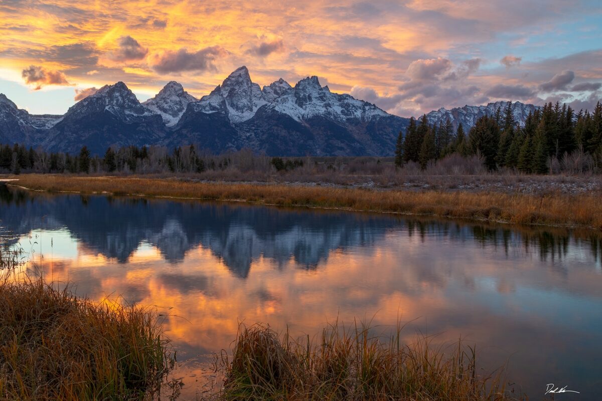 Bright reflection of a sunset at Teton National Park