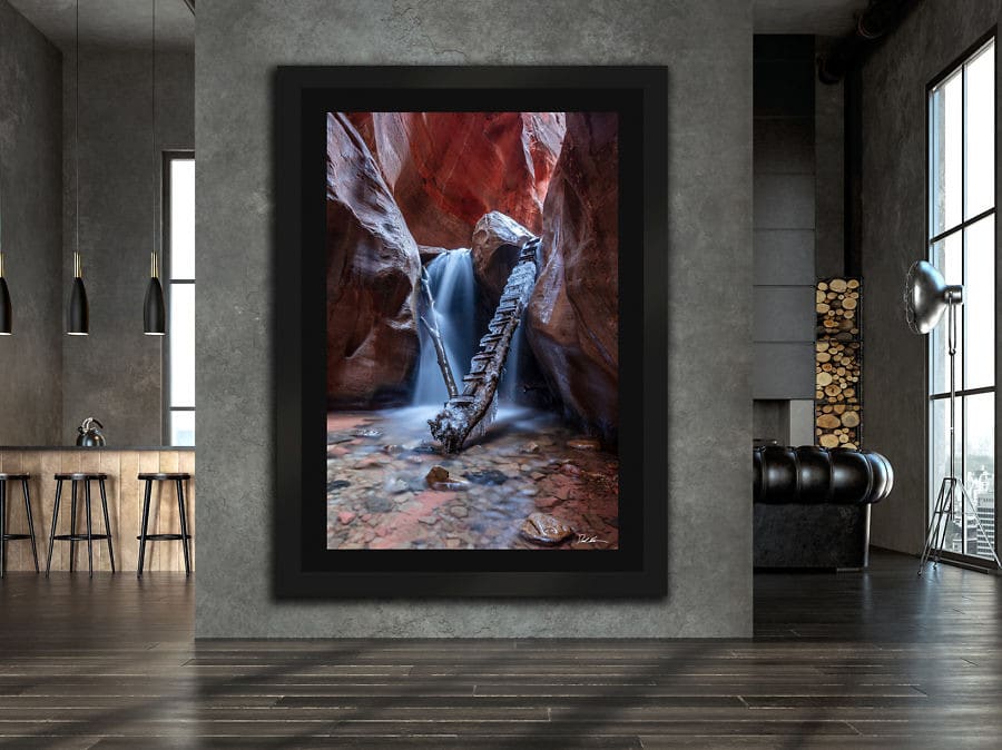 large framed image of waterfall in a canyon