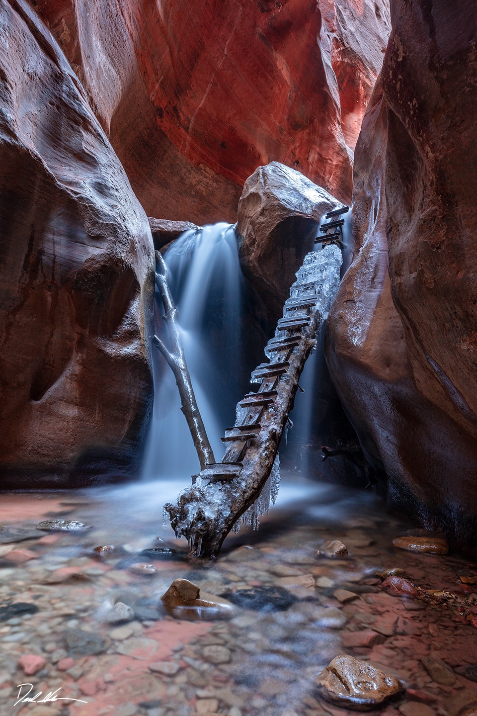 gorgeous flowing waterfall through slot canyon in Utah